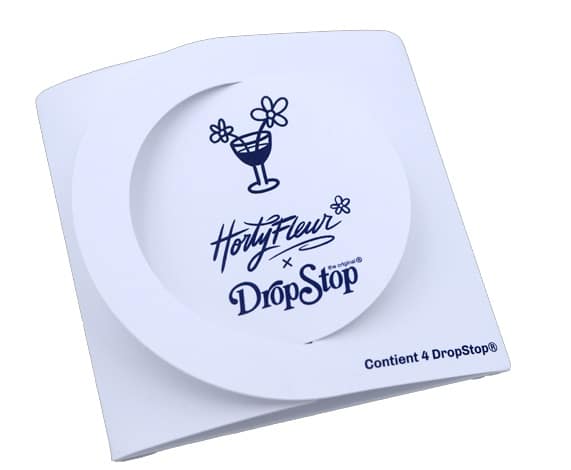 White square product packaging with the FortyFour x DropStop logo, a cocktail glass drawing, and small flowers; includes 'Content 4 Drop-Stop'.