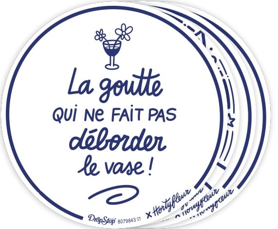Round coaster design with navy text: 'La goutte qui ne fait pas déborder le vase!' and a small cocktail illustration at the top, overlapping white and blue rings in the background.